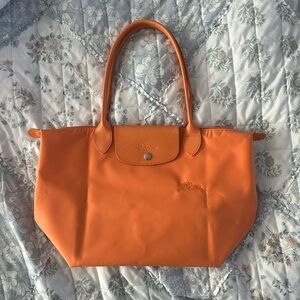 Longchamp LE PLIAGE GREEN M TOTE BAG
Orange - Recycled Canvas